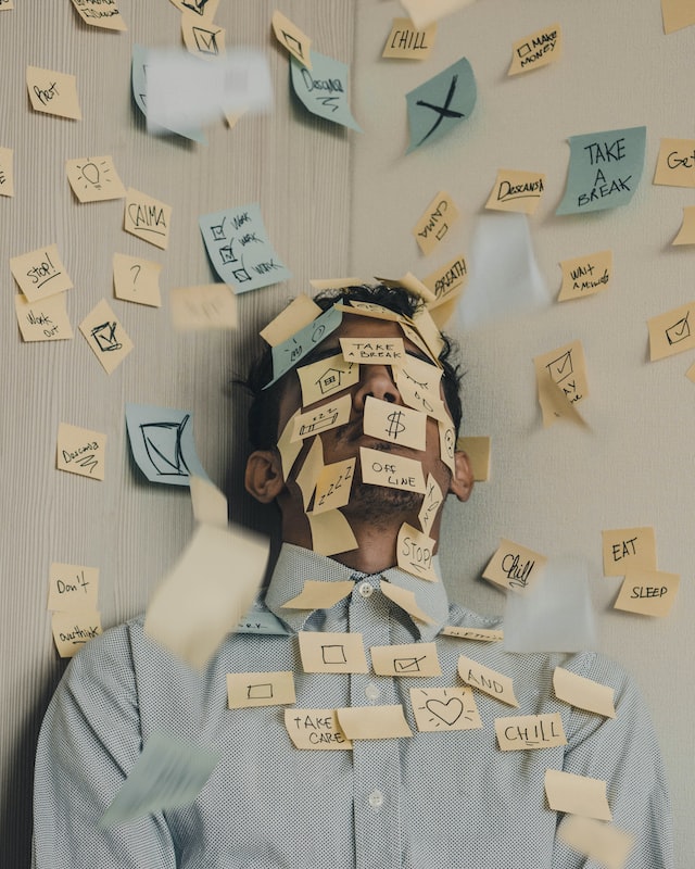 Man covered in post-its by Luis Villasmil